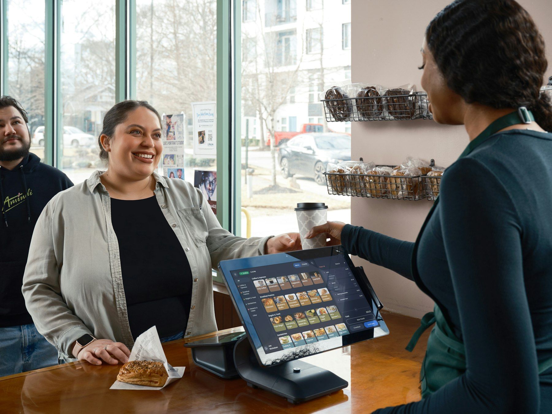 A customer leaving a review at the counter