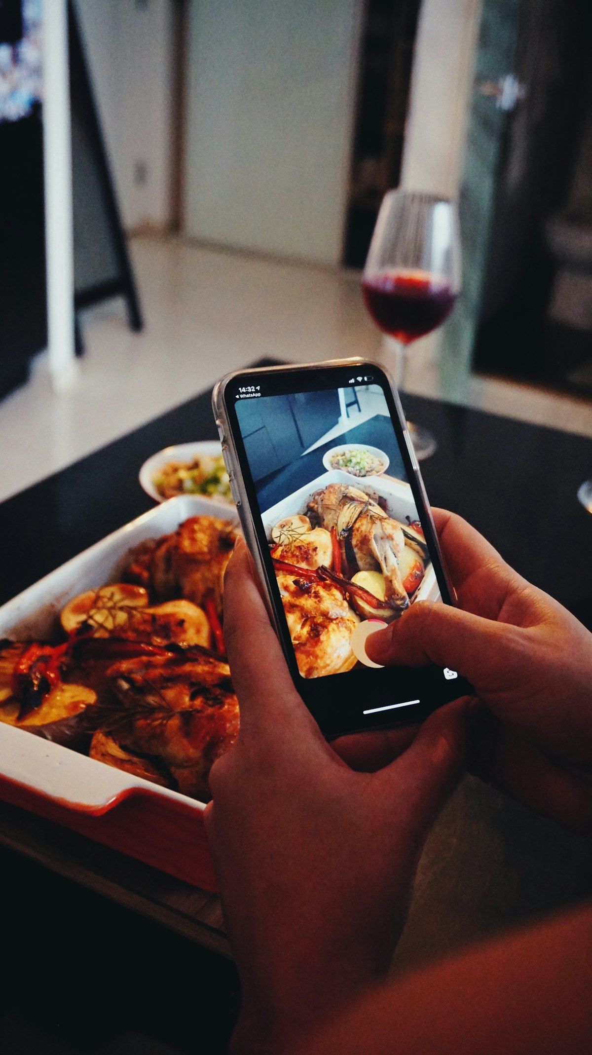 A restaurant owner filming a dish for social media
